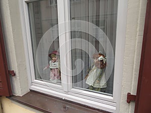 Doll toys in the window