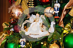 doll. vintage toys on the Christmas tree. New year retro home decor.