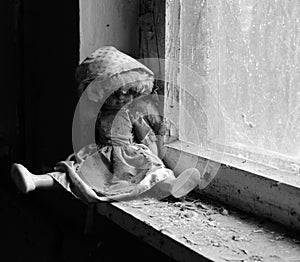 Doll on windowsill in abandoned kindergarten in destroyed village of Kopachi, Chernobyl Exclusion Zone, Ukraine