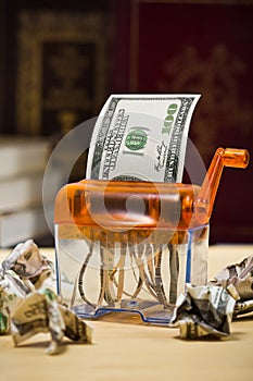 Dollar banknote in a paper shredder