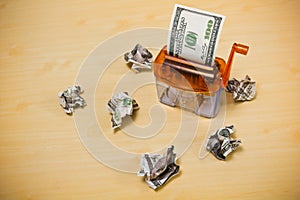 Dollar banknote in a paper shredder
