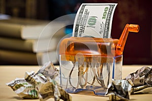 Dollar banknote in a paper shredder