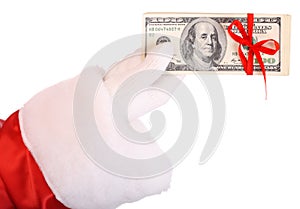 Dollar banknote in Santa Claus hand.