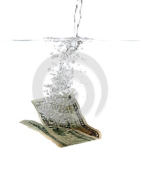 Dollar banknote in water and bubbles