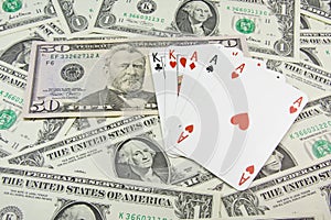 Dollar banknotes and holdem poker cards photo