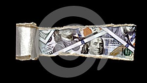 Dollar banknotes through torn black paper. Stop corruption. Black ripped paper with space for text with background of a bunch of