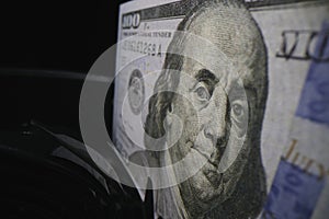 Dollar bill on banknote counter at financial establishment