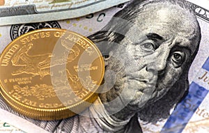 100 Dollar Bill Benjamin Franklin and American Gold Eagle Coin photo