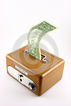 Dollar bill in cash box