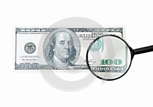 dollar bill and magnifying glass