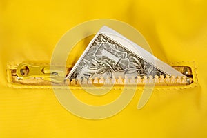Dollar bill in the zipper