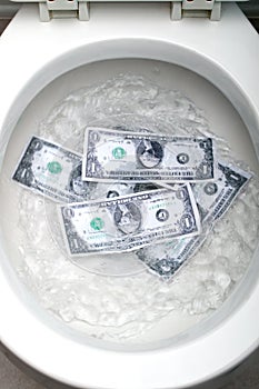 Dollar bills being flushed