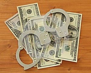 Dollar bills with handcuffs