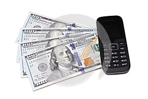 Dollar bills and mobile telephone