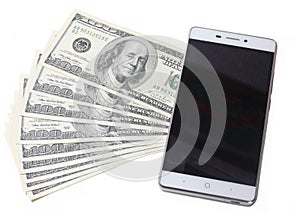 Dollar bills and mobile telephone isolated