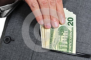Dollar bills in the pocket