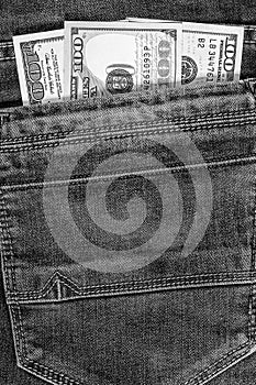 Dollar bills in the pocket of jeans