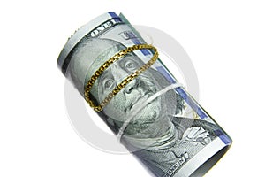 Dollar bills roll money with gold chain