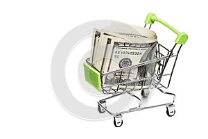 Dollar bills in the shopping cart trolley on white background. Idea: sale of goods, discounts, buying selling, going to the shop
