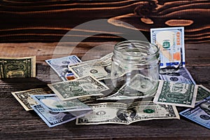 Dollar bills on the wooden table. Financial background.