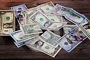 Dollar bills on the wooden table. Financial background