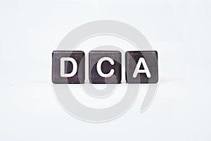 Dollar cost averaging DCA text on cubes on a white background