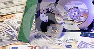 Dollar and Euro Banknotes under Hard Drive CPU and RAM stick