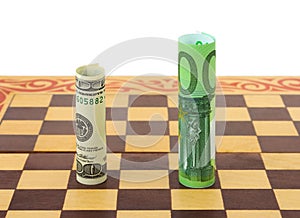Dollar and euro on chess board