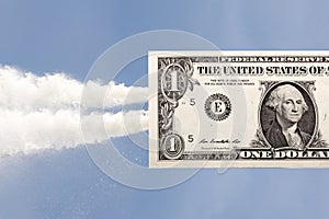 A dollar flying into the sky. the concept of currency growth