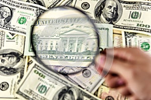 Dollar with magnifier. Magnifying glass and money. Business concept background.