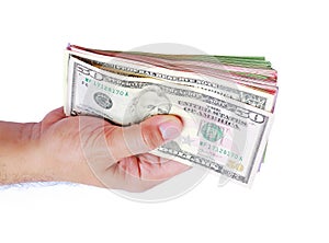 Dollar money showing in men`s hand on white background.