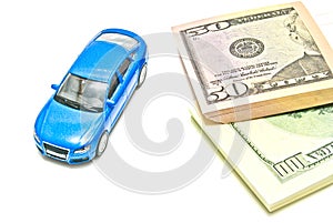 Dollar notes and blue car on white