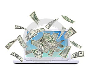Dollar notes flying around the laptop