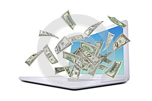 Dollar notes flying around the laptop