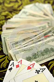 Dollar notes and poker cards, gambler tools