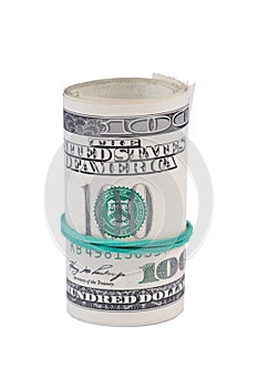 Dollar roll tightened with green rubber band.