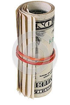 Dollar roll tightened with rubber band. Rolled money isolated on white.
