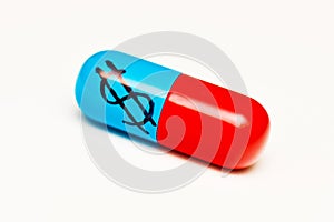 Dollar sign on capsule photo