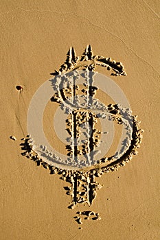 Dollar sign in the sand