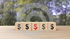 $ Dollar sign symbol word wooden cubes on table horizontal blur green forest trees with sky background, mock up, template, banner