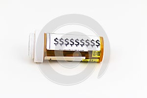 Dollar signs on a prescription pill bottle with a white background