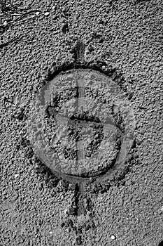 Dollar symbol drawn on the sand