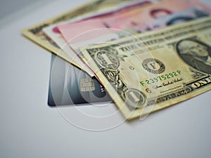 Dollars Baht Kyat and Yen over credit card