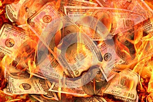 Dollars Banknotes or bills of United States of America dollars burning in flame concept of crisis, loss, recession failure