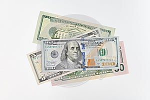 5, 20, 50, 100 dollars banknotes at different angles. Close up of dollars on white background.