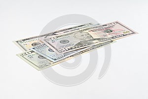 5, 20, 50, 100 dollars banknotes at different angles. Close up of dollars on white background.