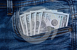 dollars bills lies in jeans pocket.money in wallet.savings.cash.international currency. 1