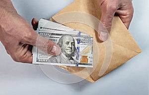 Dollars cash in envelope. Bribery, illegal salary, financial crime concept
