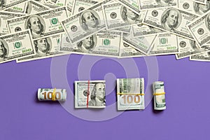 Dollars currency on colored background top view, with empty place for your text business money concept. One hundred dollar bills