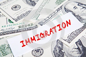 Dollars currency with Immigration word